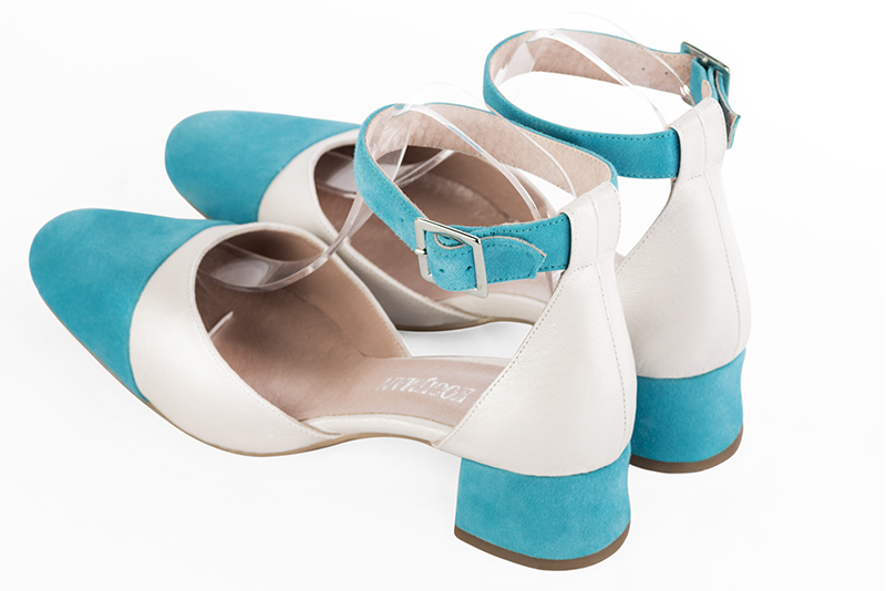 Turquoise blue and off white women's open side shoes, with a strap around the ankle. Round toe. Low flare heels. Rear view - Florence KOOIJMAN